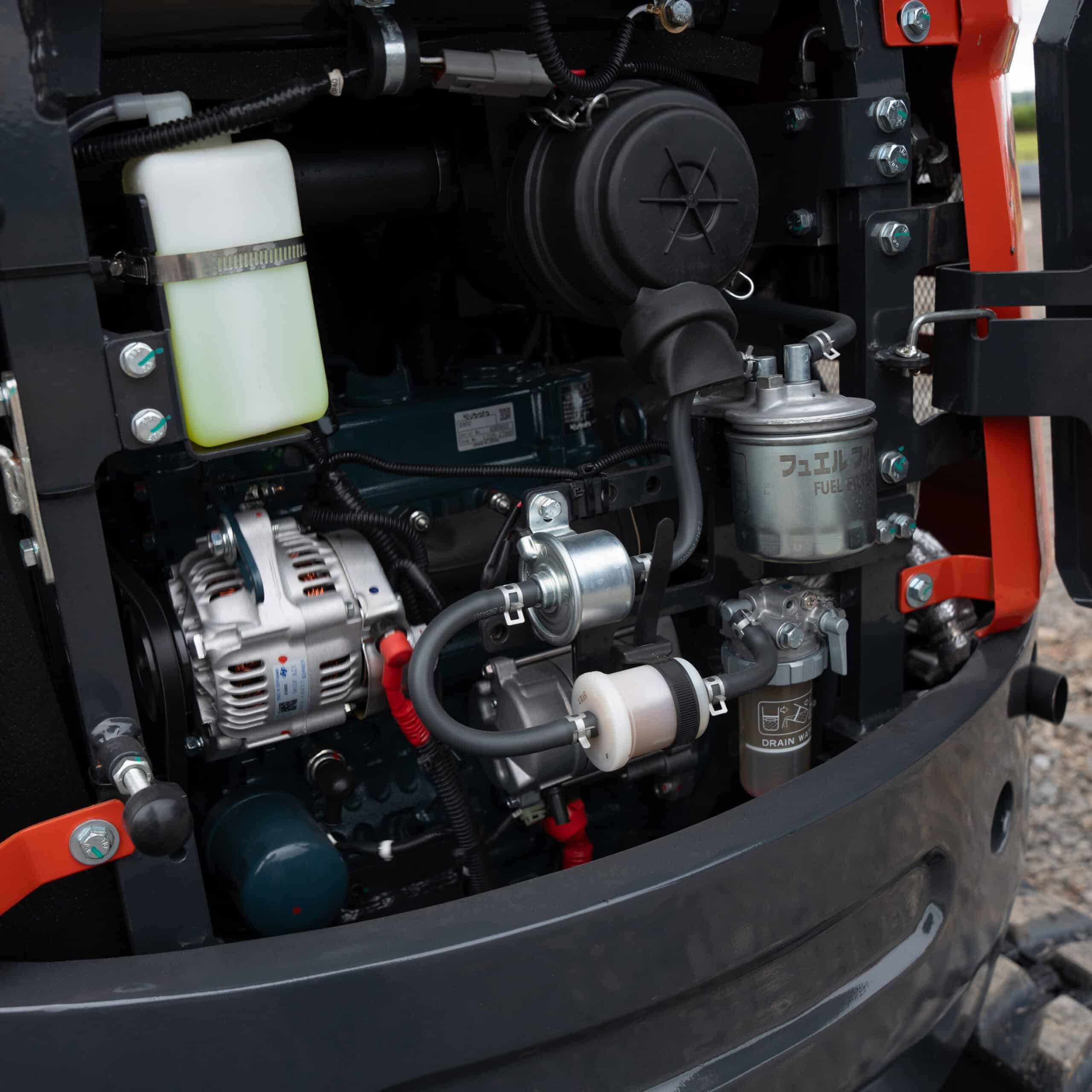 Close-up of Yardex Group industrial machinery engine components.