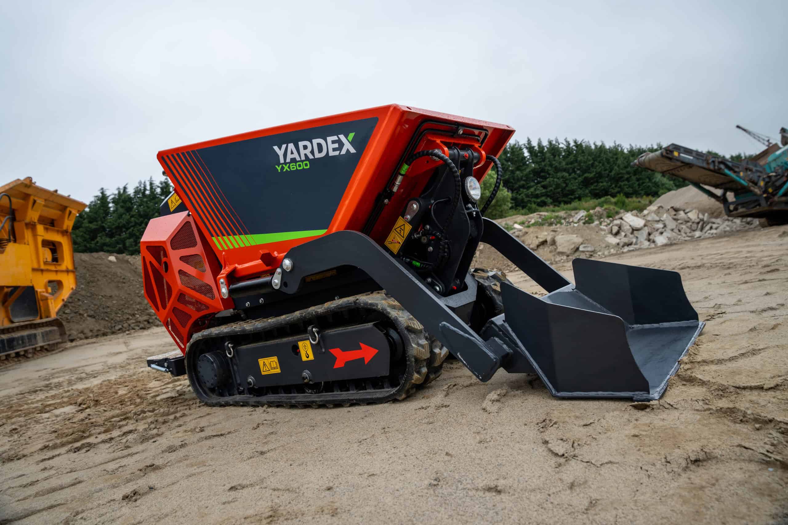 Yardex YX800 compact excavator on construction site with tracked wheels.