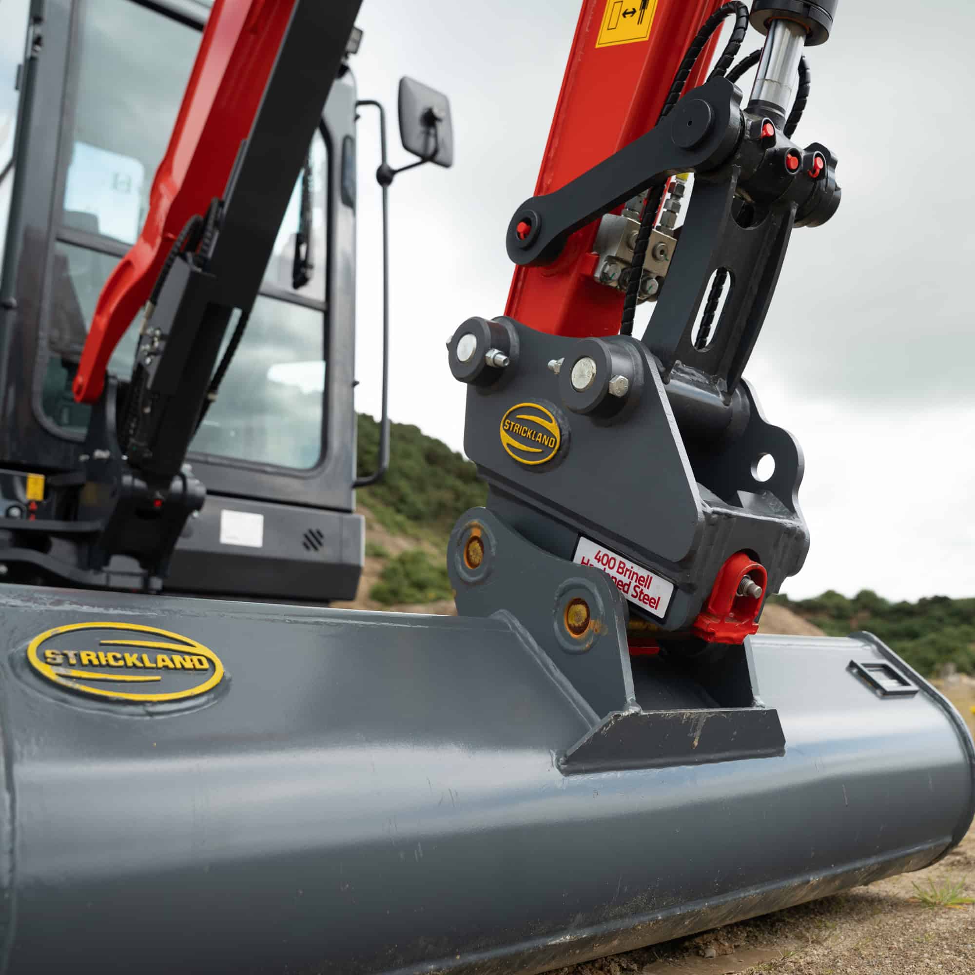 Close-up of excavator arm and bucket for construction work.