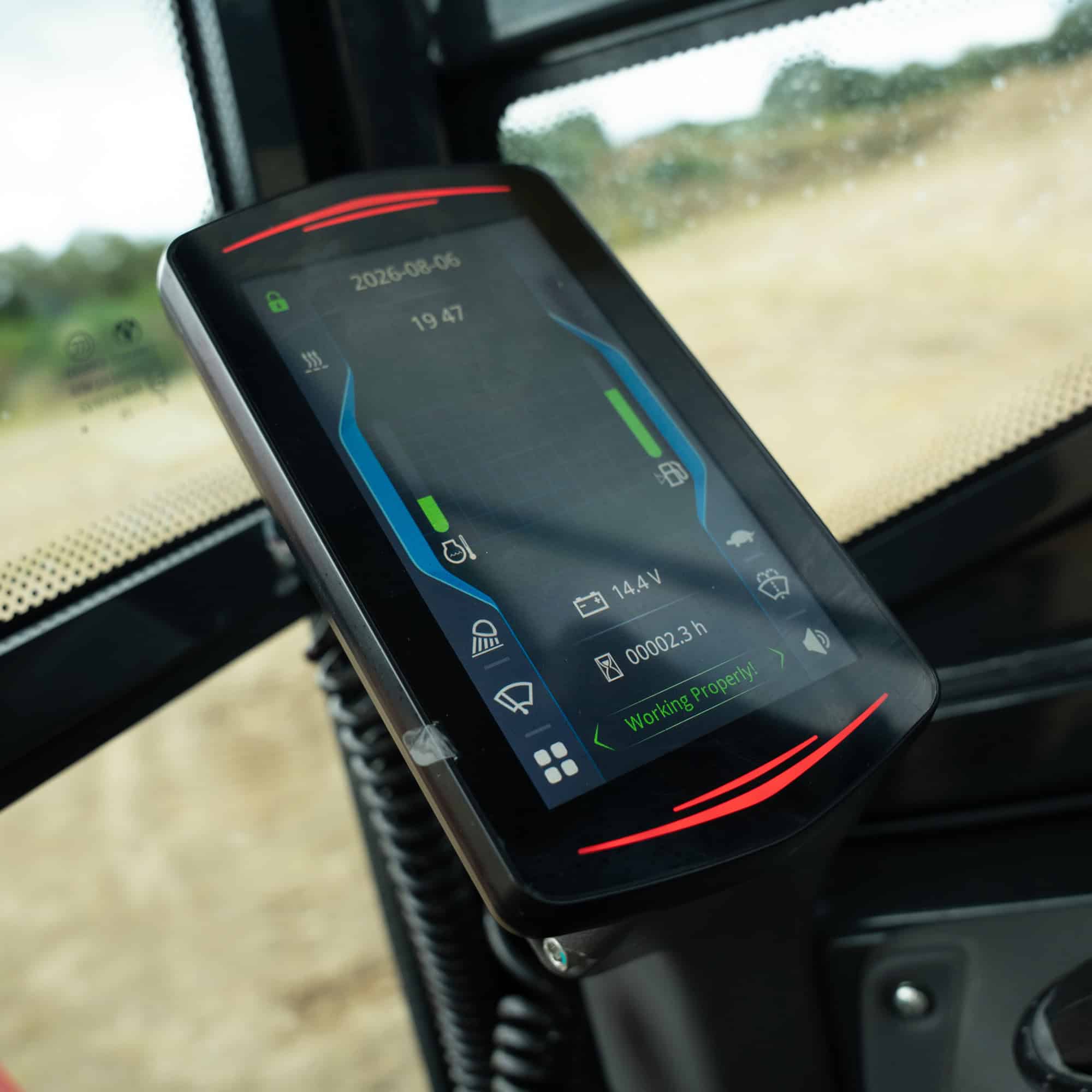 Close-up of Yardex Group industrial monitoring device on machinery dashboard.