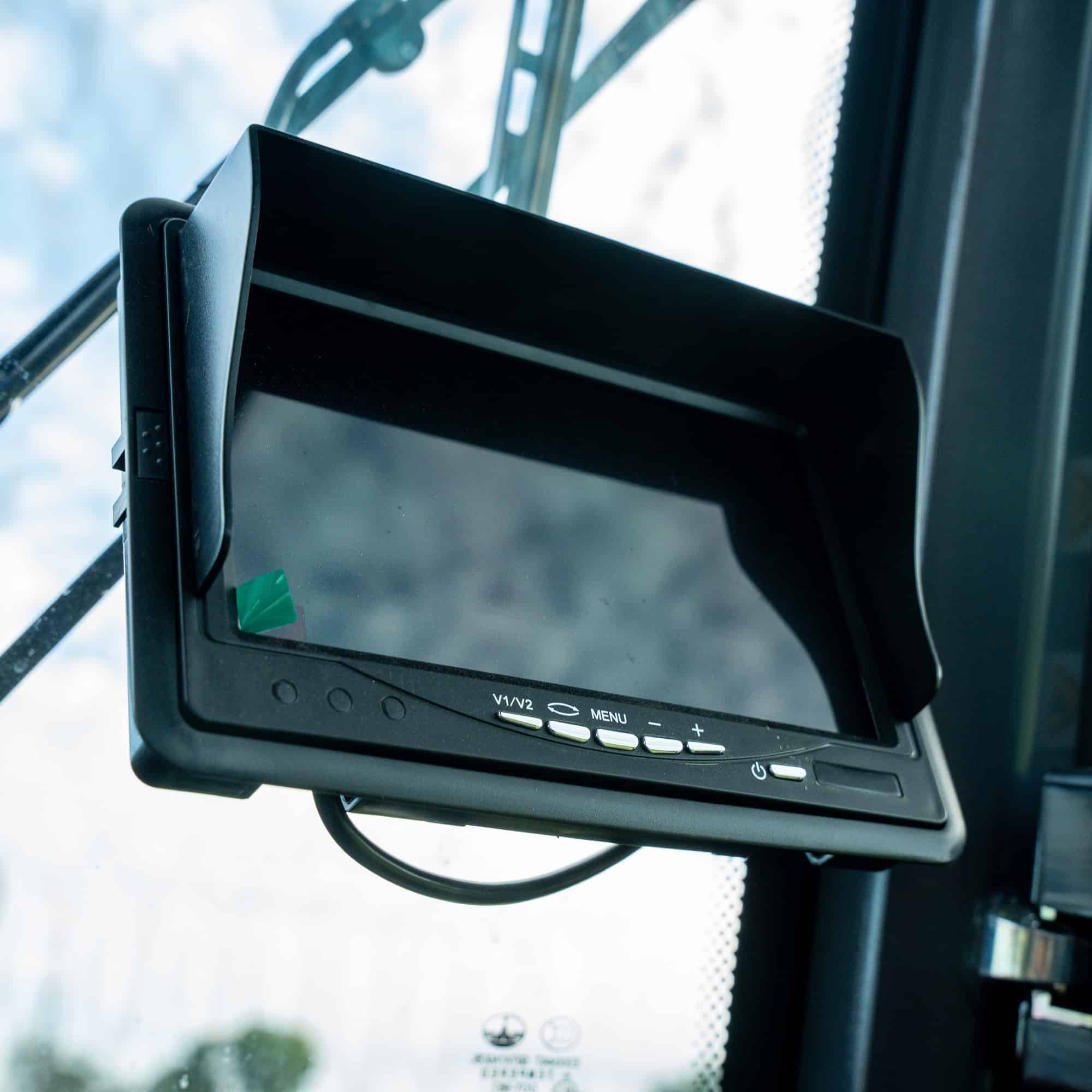 Close-up of a digital display screen on heavy machinery at Yardex Group.