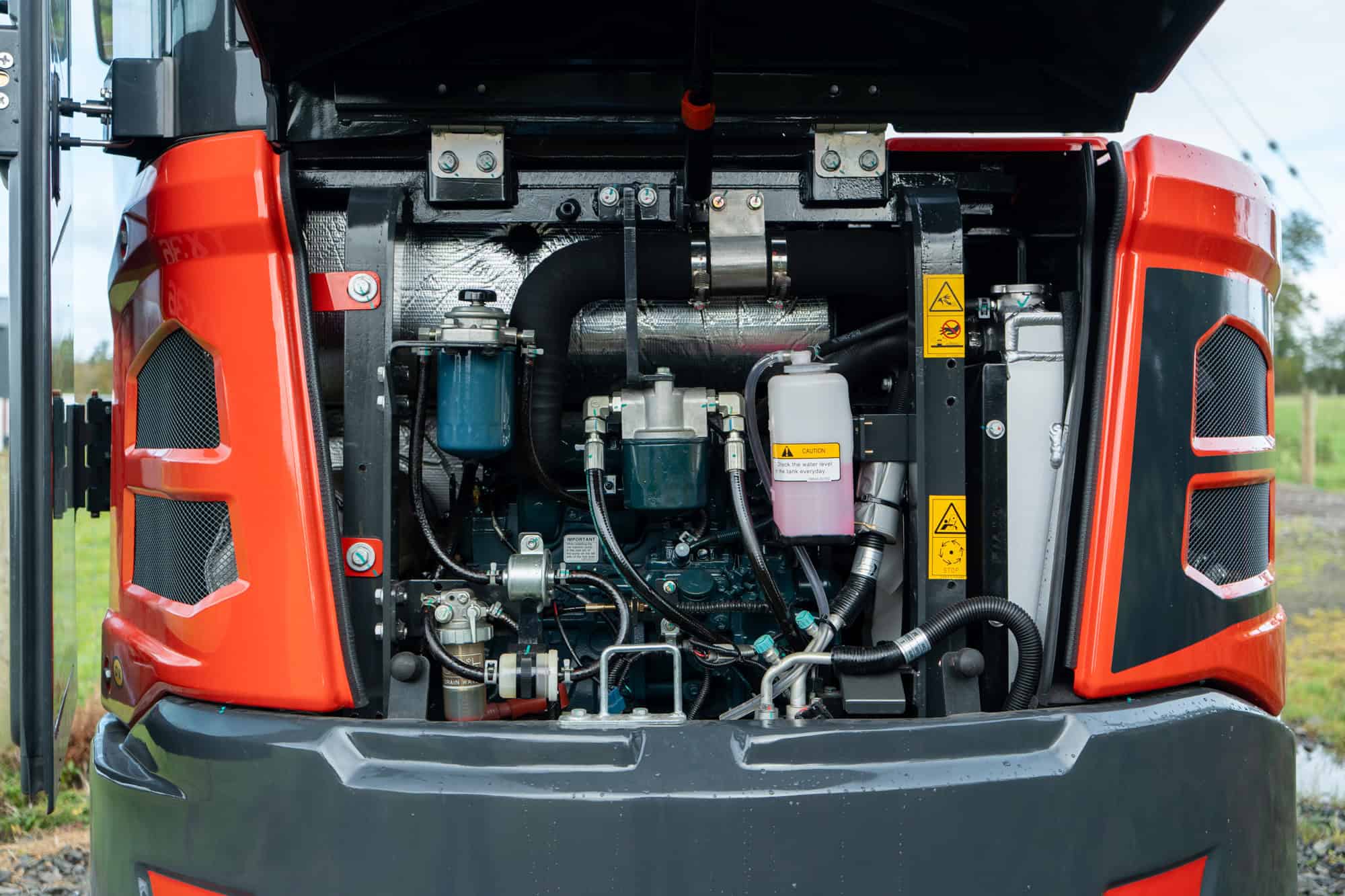 Close-up of Yardex Group heavy machinery engine with detailed components.