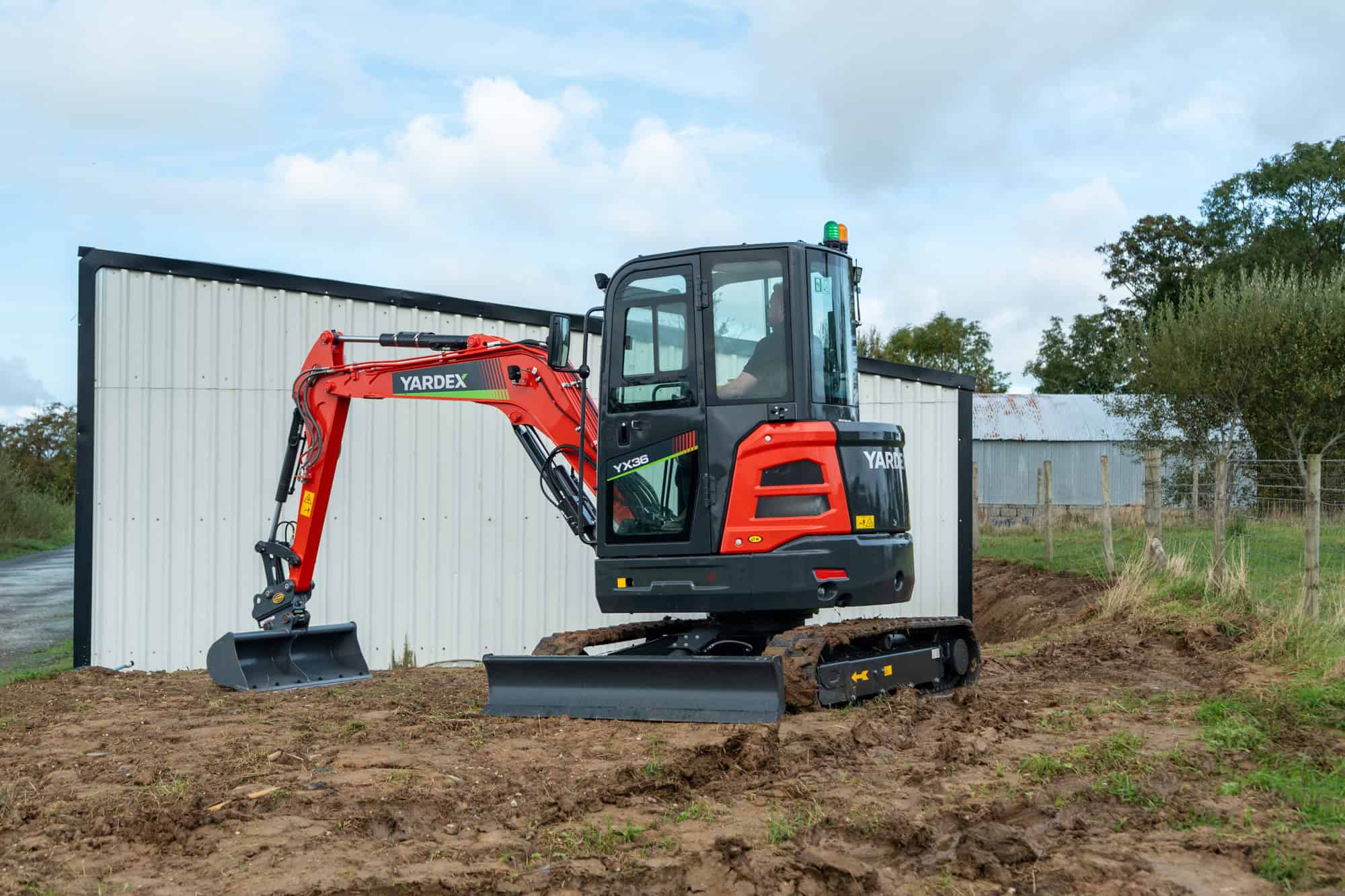 Yardex compact excavator working on a construction site.