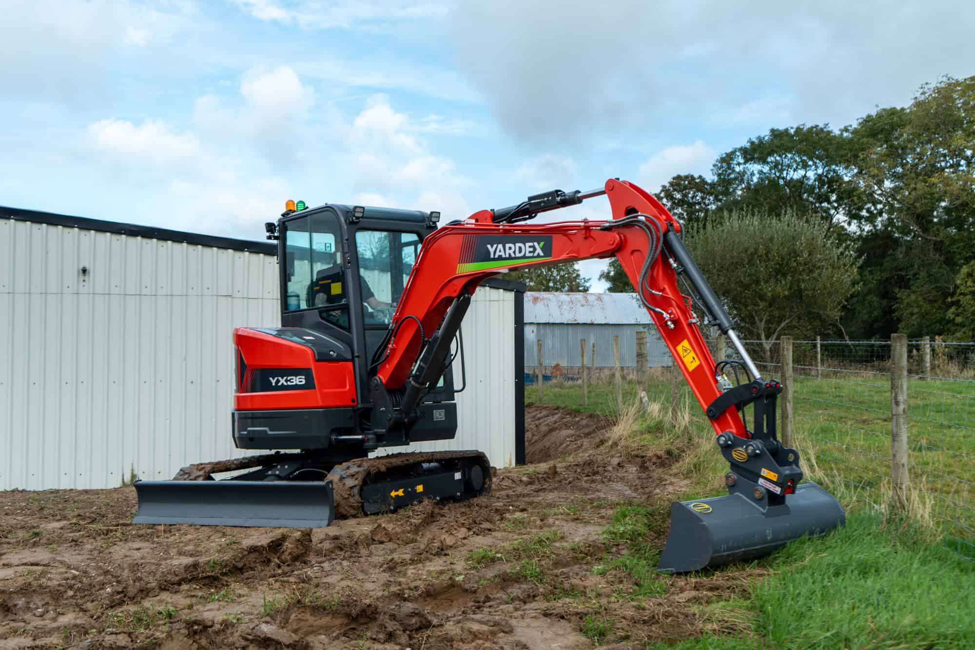 Yardex Group mini excavator working on a construction site.